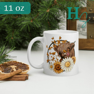butterfly highland cow sunflower mug ceramic honeypegs store graphic artist designs highland cow cute licking nose sunflower mug two sized 11 oz and 15 oz mugs high quality crisp print beautiful mug cow lover gift highland cow lover gifts cow mom mug butterfly cow mug white sublimated mug high quality designs prints apprel clothing brand made in USA America